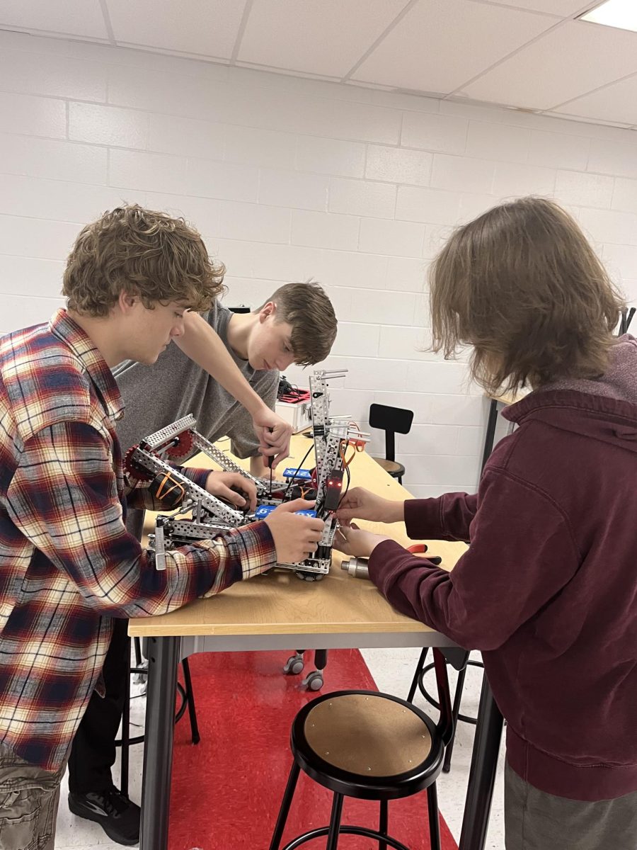 Pictured+above+are+Levi+Henry%2C+Stephan+Jones%2C+and+Wyatt+Wheeler+working+on+their+robot.+