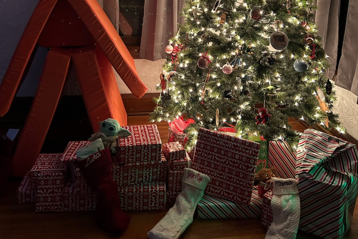 Christmas gifts waiting under the tree for eager children.