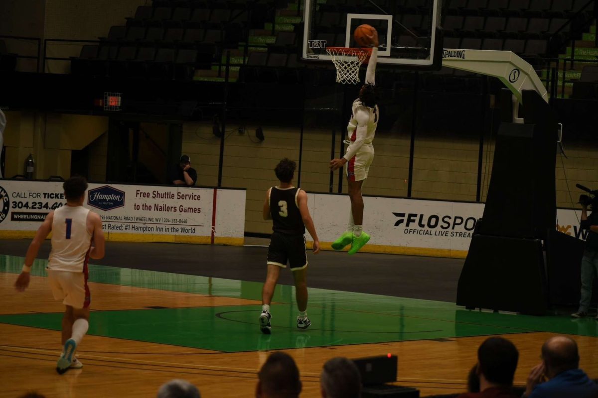 Senior Mykel Davis elevates for the dunk.