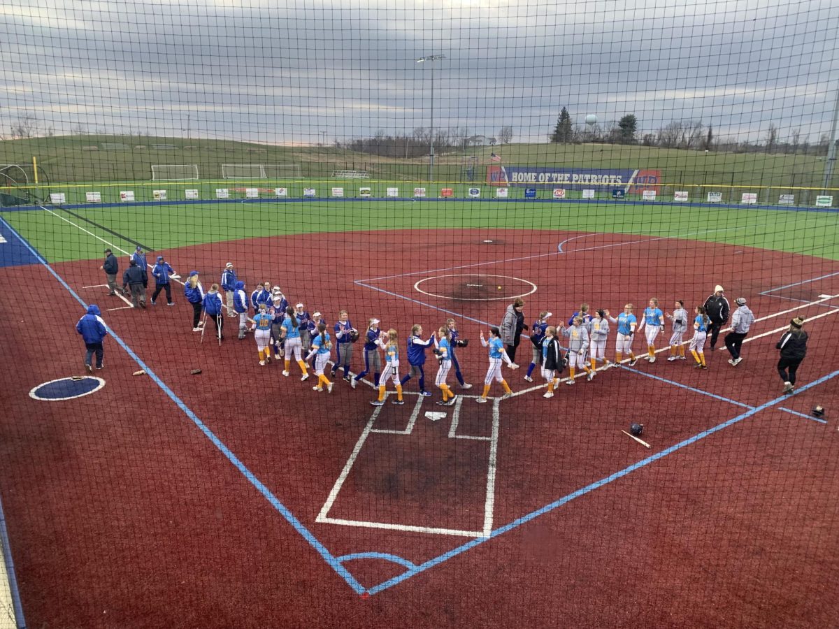 At the end of the game the two teams high five and tell each other  ¨ good game." The team talks about the game and the outcome before packing up and getting prepared for the next game. 