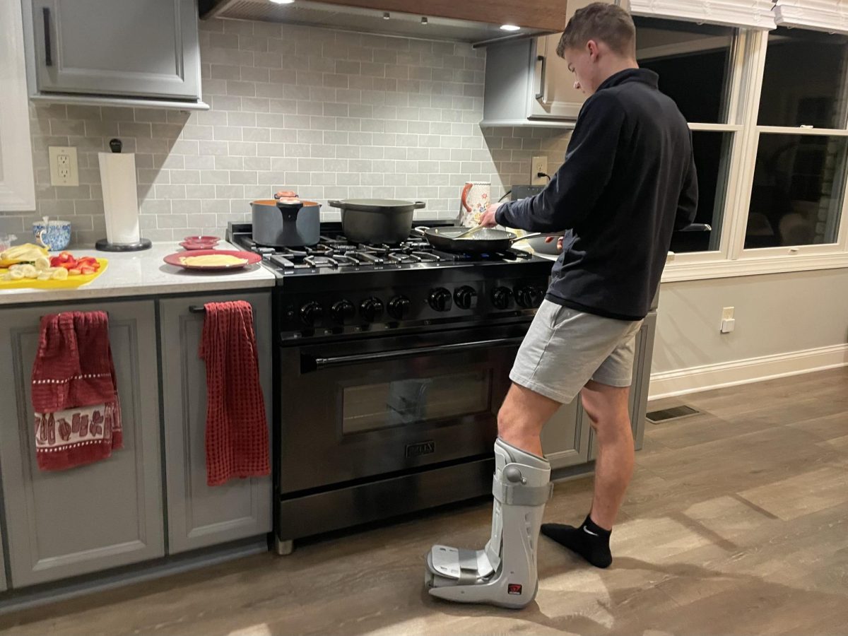 As a late night treat, Aderholt cooks crepes for his family. He finds new ways to participate in family activities while staying somewhat immobile. 