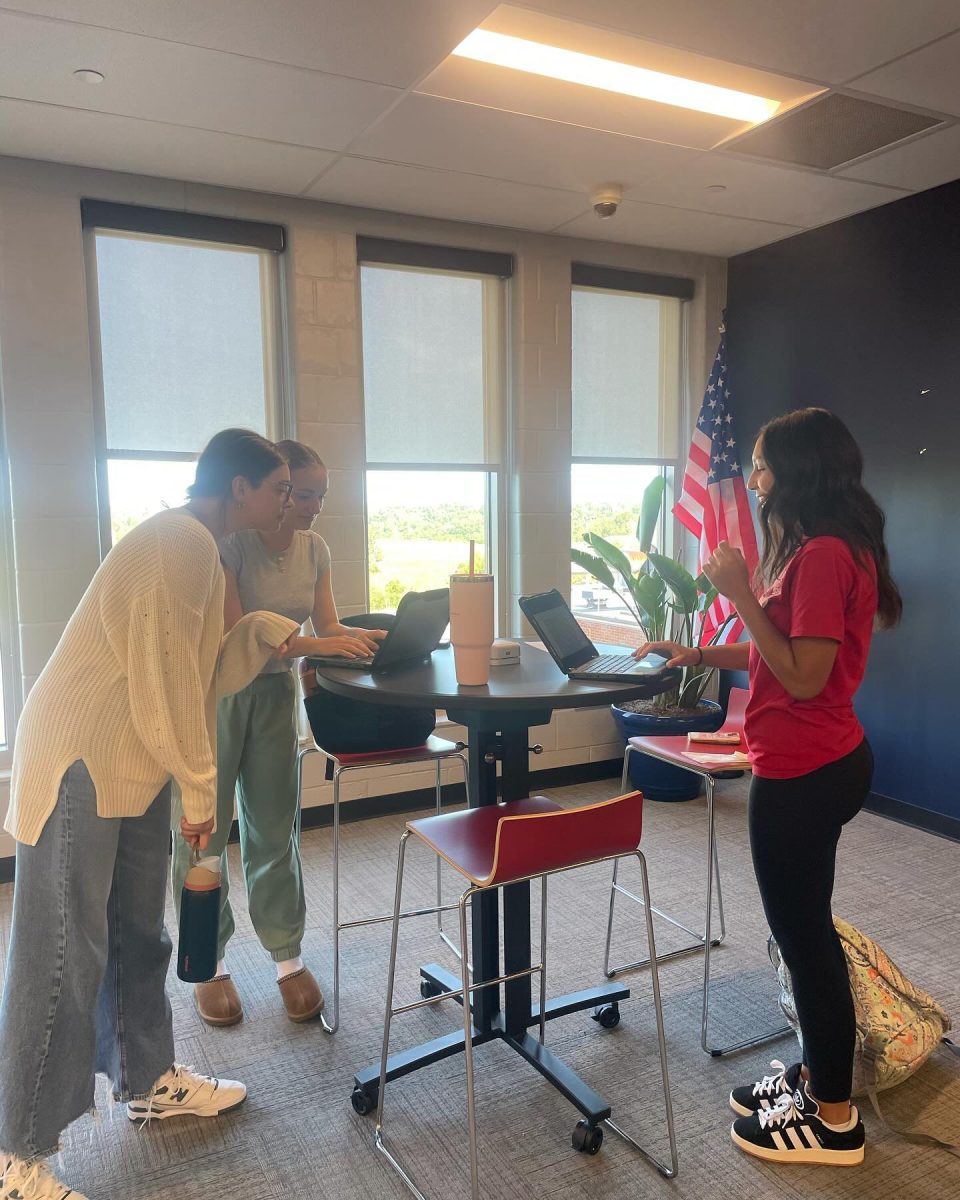 Grace Robertson-Villamagna, Audrey Kenamond, and Gianna Mills practice after school in the ILC to prepare for the upcoming tournament.