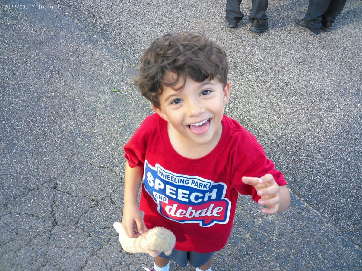 Mrs. Droginske's son, Luka, vies for the camera on the sidelines.