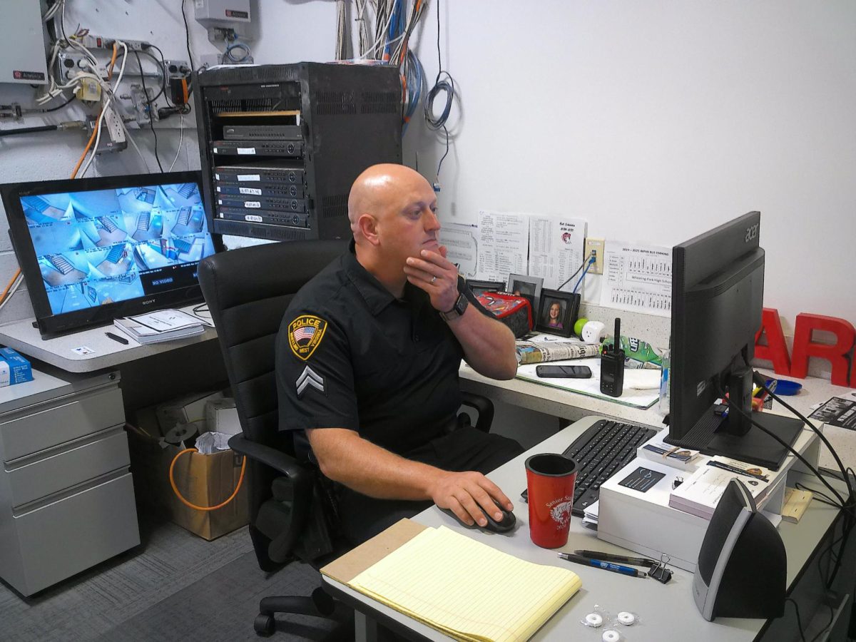 Officer Wilson checks cameras and monitors the building.