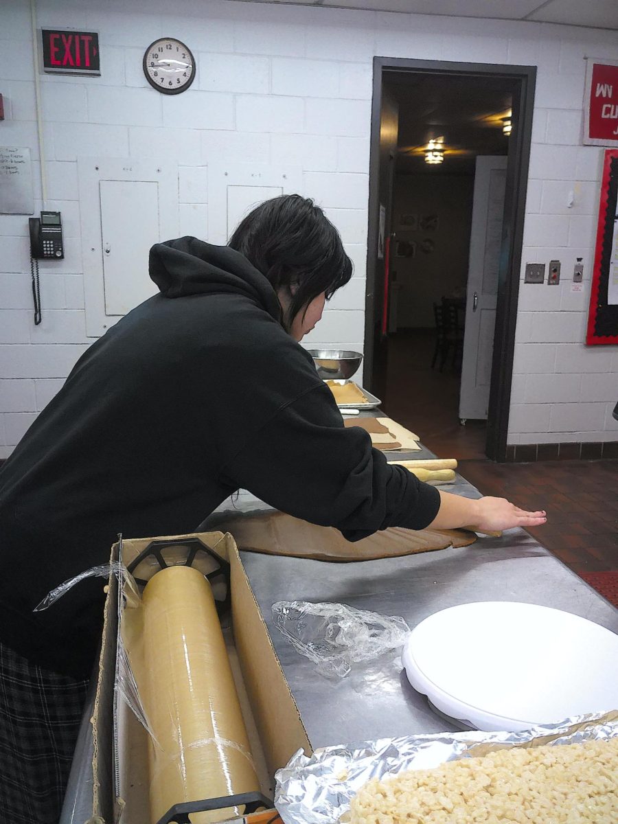 Julliana Snivley practices and prepares in the Patriot Cafe kitchen for the big event. 