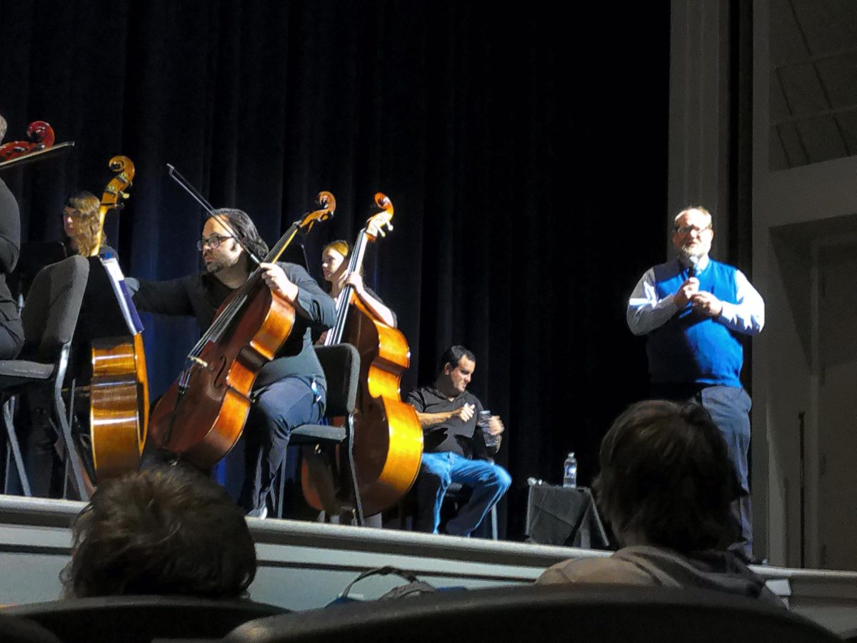 James A. Grymes, author of Violins of Hope, address the students of Wheeling Park High School in the Performing Arts center.