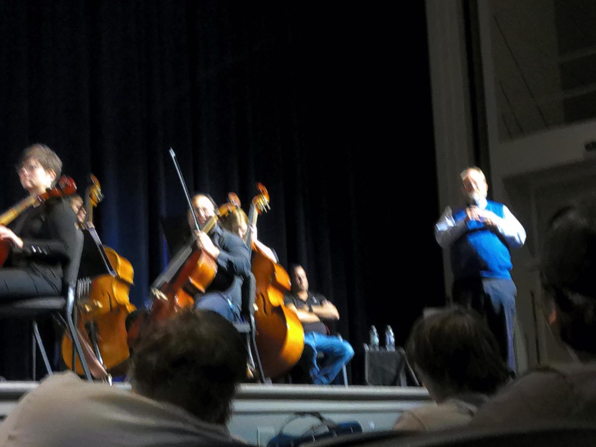 James A. Grymes, author of Violins of Hope, address the students of Wheeling Park High School in the Performing Arts center.