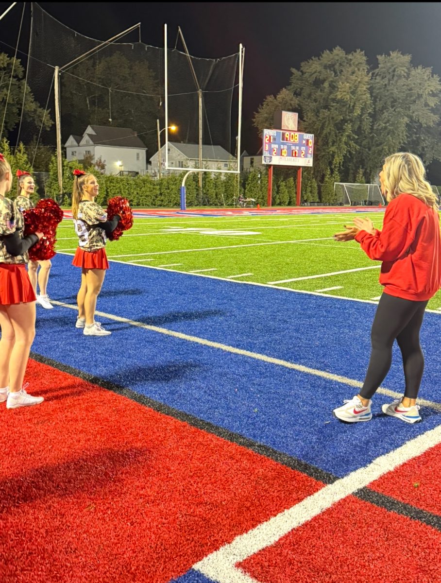 Coach "Shep" in her element with her current cheer team. 