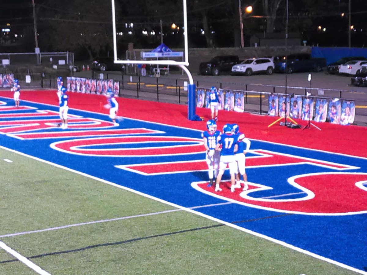 Members of the football team celebrate a touchdown.