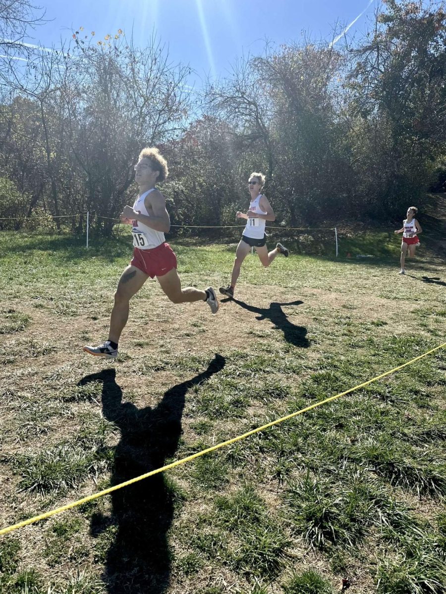 Redick Moore fighting to stay in front of his little brother who is trailing behind just one person. 
Courtesy of Redick Moore