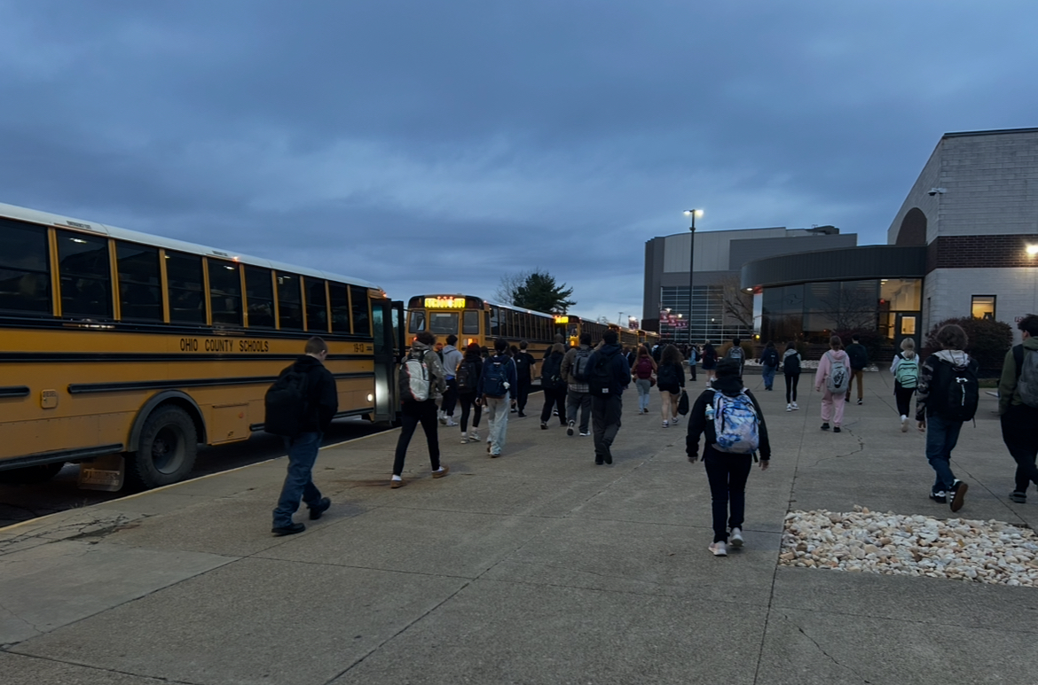 Students empty from their busses in the early morning to attend their school of choice.