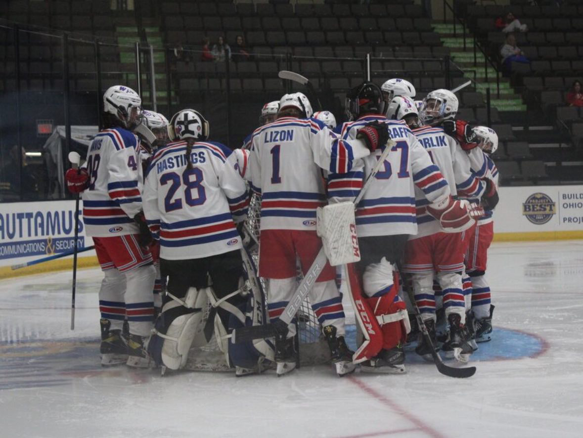 The hockey team gathers together before a game. Courtesy of Kaden Schnarr.