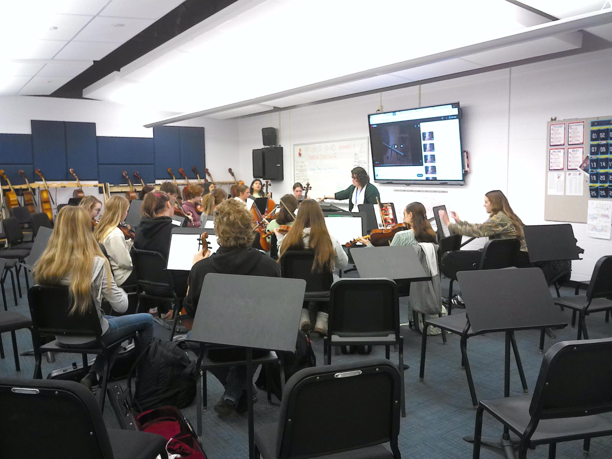 Strings prepares for the first Festival of Sound with Ms. Grube conducting the chairs.