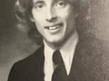 Young Dr. Romick posing in his suit for a picture.