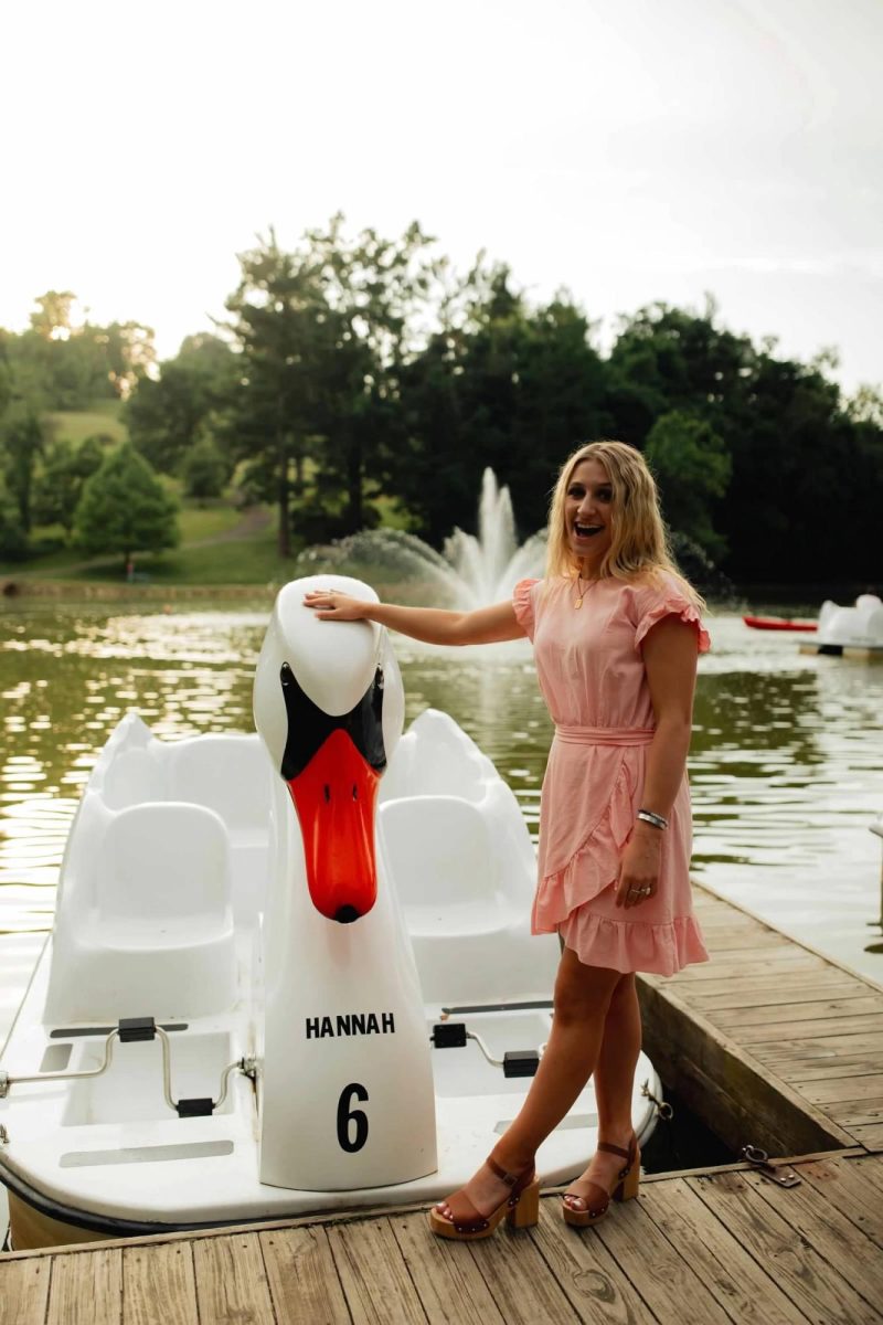 Hannah Seivertson posing for her senior picture by her swan boat at Schenk Lake. courtesy of Riley lynn Photography.