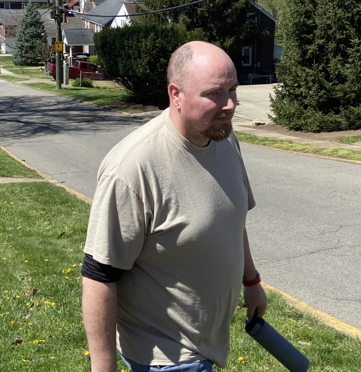 Jo's father locked the door and walked across the lawn, getting ready to lead the family on the walk to the playground. 