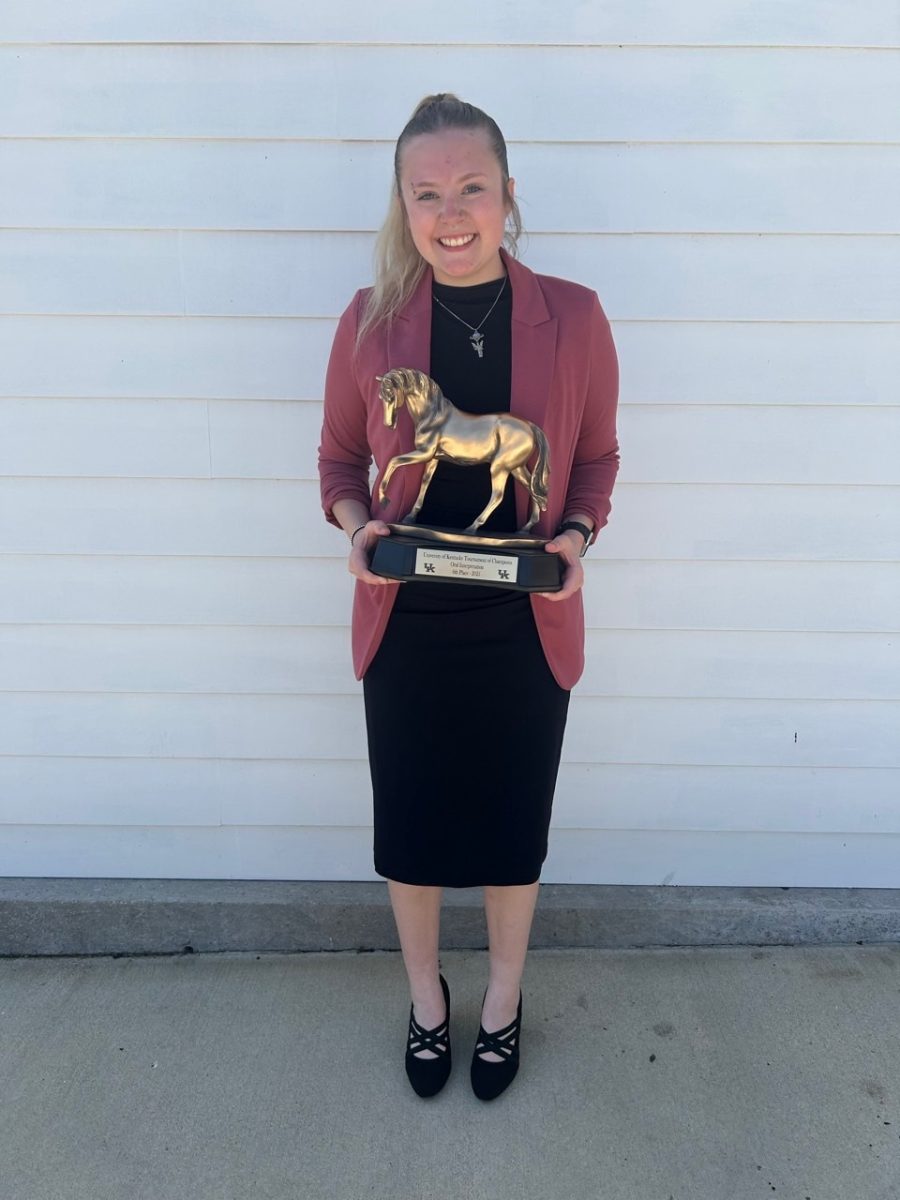 Kelsey holding her sixth place trophy for oral interpretation of literature from the JW Patterson Tournament of Champions, a national speech and debate competition. 