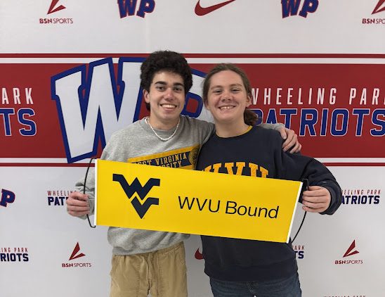 Two seniors celebrating their choice to stay in state for college.