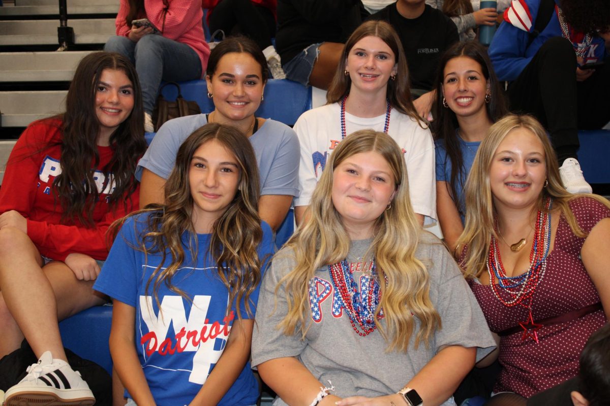 Freshman sitting in the stands of their first pep rally at Park. 