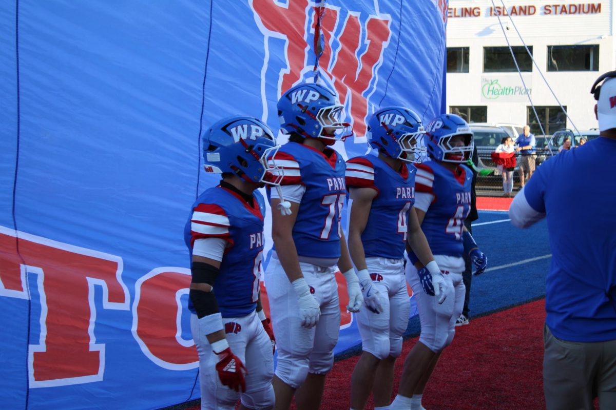 The captains for the game get ready to lead the team on to the field for Friday's Home game against Parkersburg South. 