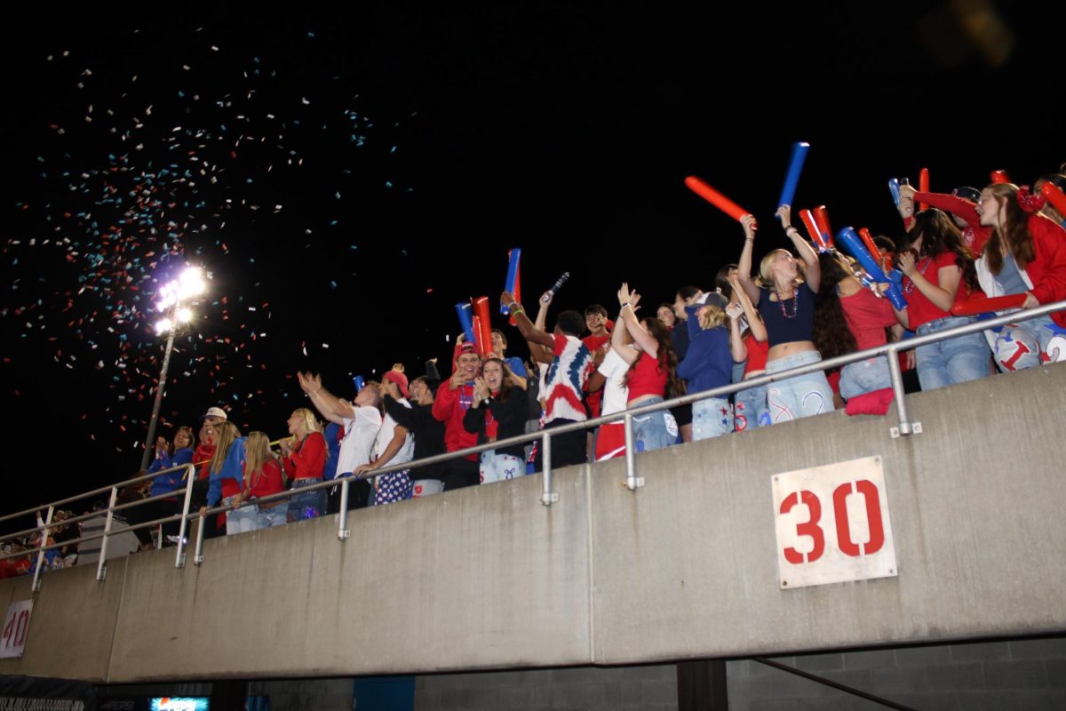 Student section celebrating a touchdown in the second half of Friday's home game against Parkersburg South. 