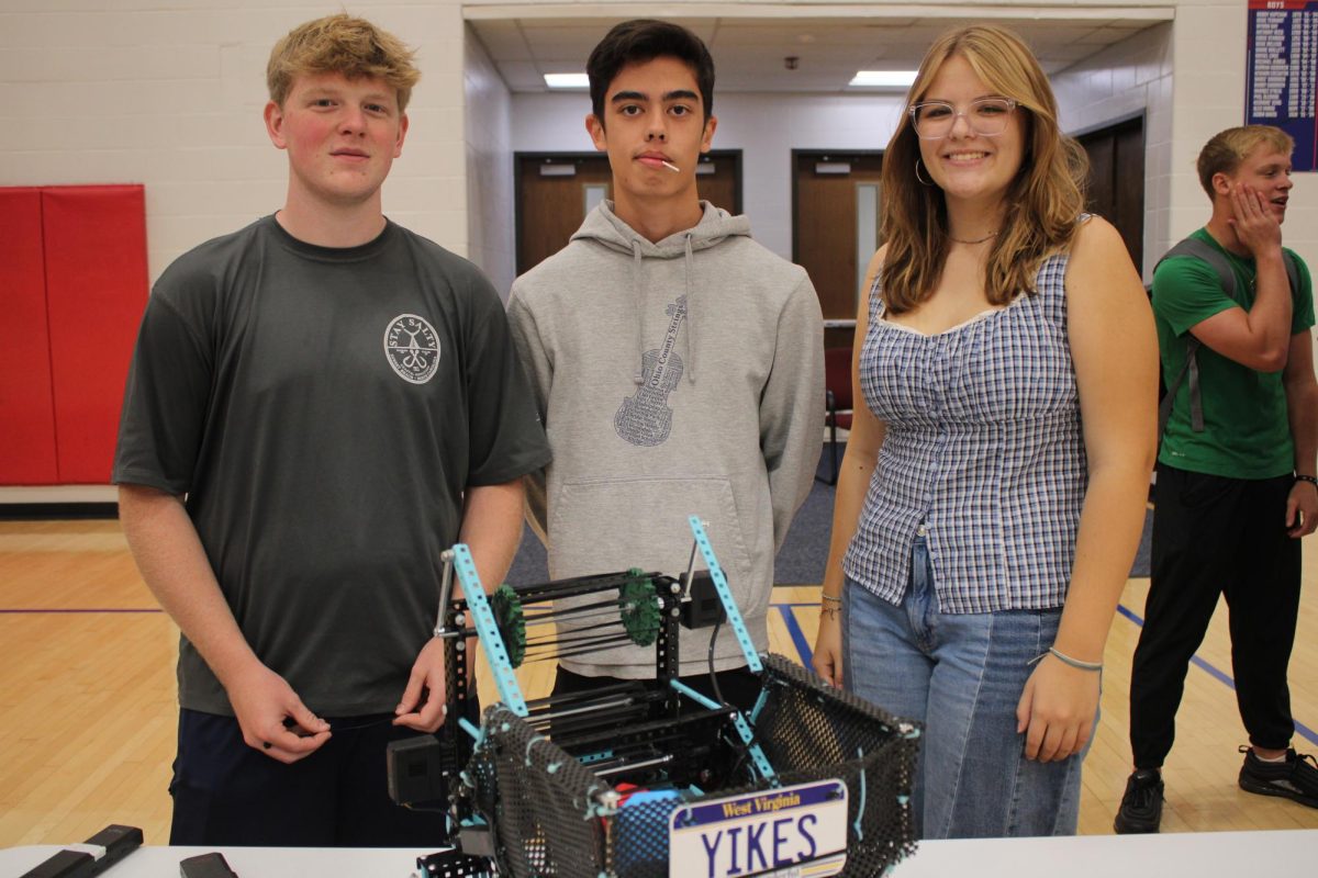 Josh Hess, Rex Montanye, Maya White represent the Robotics club.