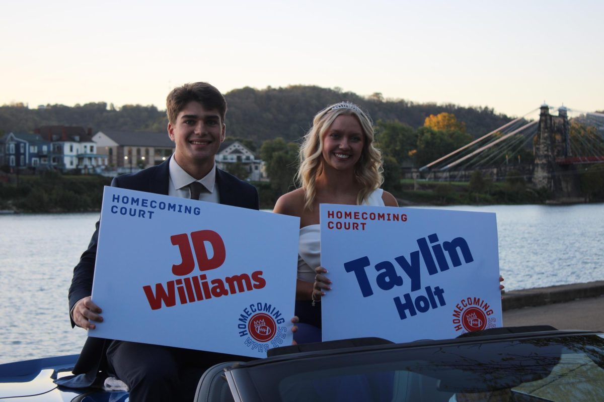 JD Williams and Taylin Holt enter the parade as king and queen nominees.
