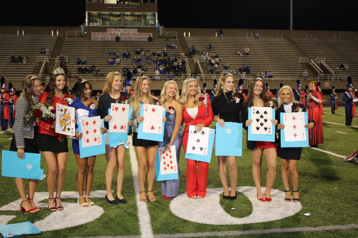 The Queens on the field moments after the results