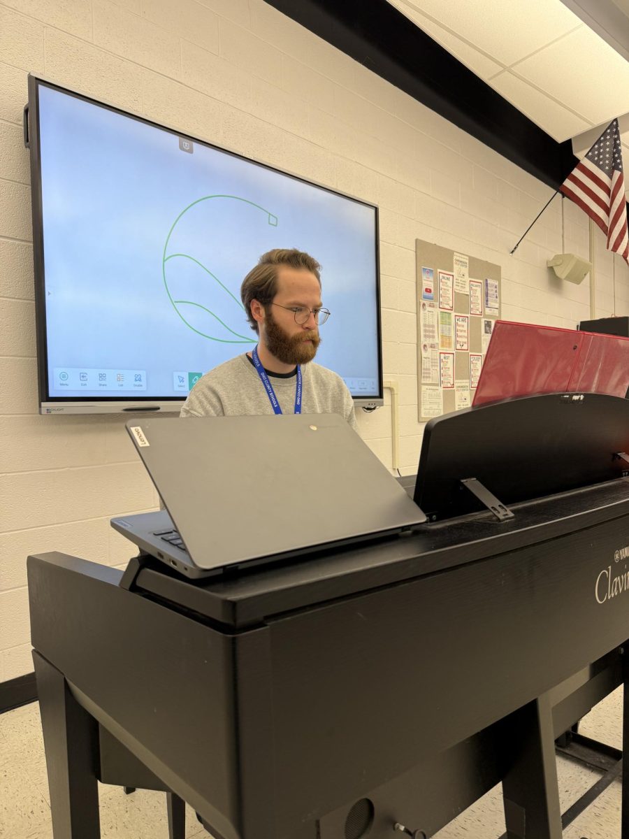 Mr. Mazure playing the piano