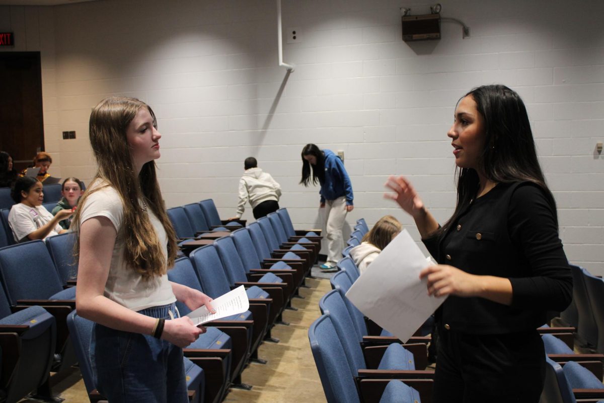 Gianna Mills welcomes middle school students in the Beneke for the Middle School Speech and Debate Workshop during the school day on January 9th.