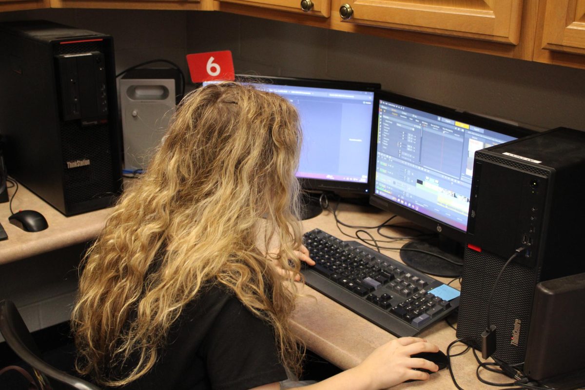 Broadcasting student Clara Demasi edits the latest edition of "The Patriot Connection". 