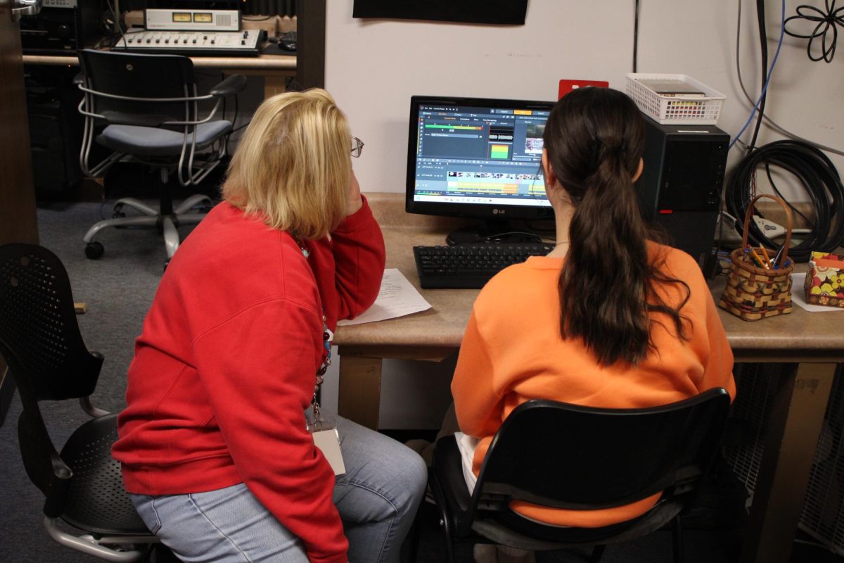 Broadcasting teacher Mrs. Dillion mentors student London Miller. 