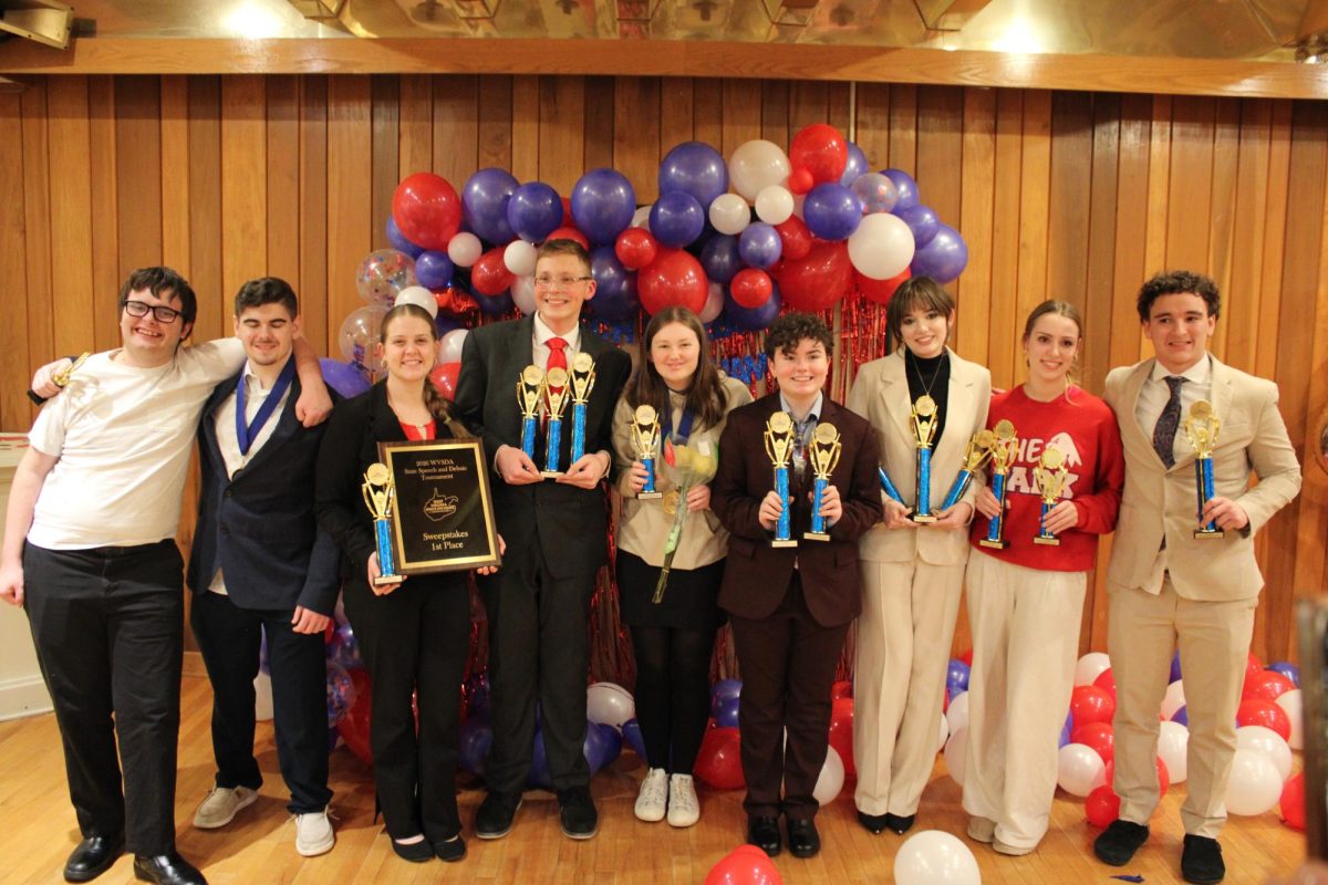 Seniors on the Speech and Debate Team celebrate their successful homecoming at the White Palace. 