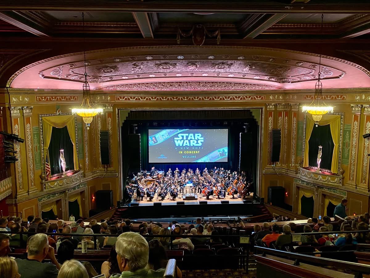 The inside of the Theatre itself looks gorgeous, with architecture from 1928 still shines today. The Wheeling Symphony Orchestra takes the stage, and the crowd waits patiently for the show to begin. 