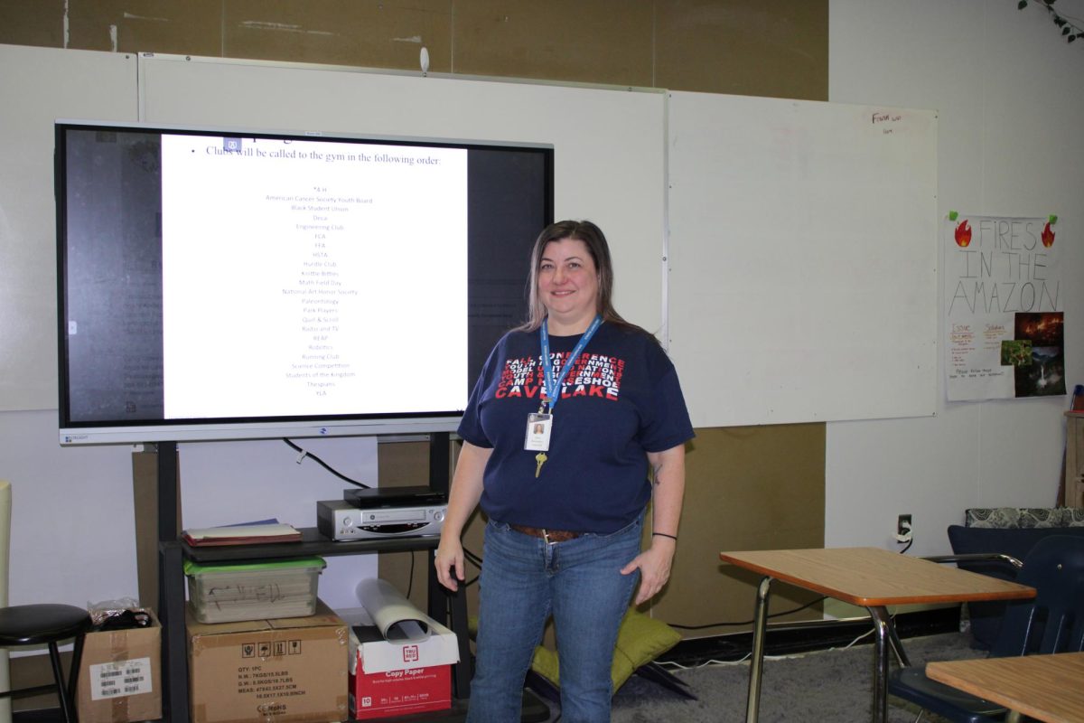 Ms. Richardson offers a smile as she teaches in her classroom. 