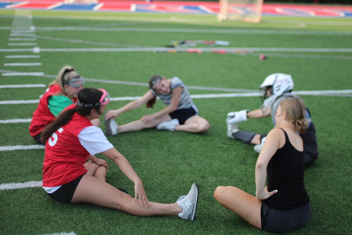 Stretching legs to relieve any tight muscles to avoid injury