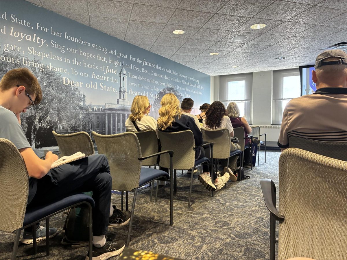 At the begging of the tour, many families are grouped into a room for an introduction to the school. Each individual family is deep in discussion analyzing the school and the decision that awaits them.