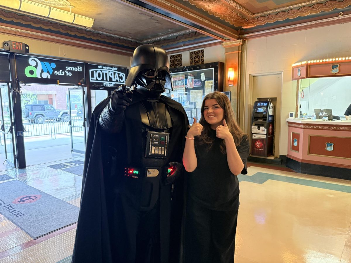 Before the crowd rolls in, characters from the movies stake their ground at the Theatre. Darth Vader loves a picture with fans, or even workers. 