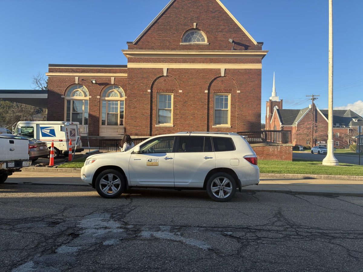 Julie works at The Wellsburg Post Office. She is a rural carrier, meaning she delivers mail to homes not in the city limits of Wellsburg. Contrary to popular belief, not all mail carriers wear uniforms and drive mail cars. Rural carriers often drive their own modified cars for routes. 