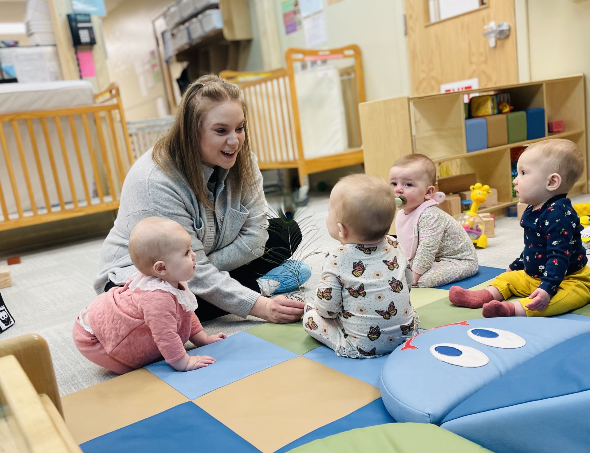 Antonella Claudio, a teacher in the infant room at Holy Family Child Care Center. Photo courtesy of Terra Crews