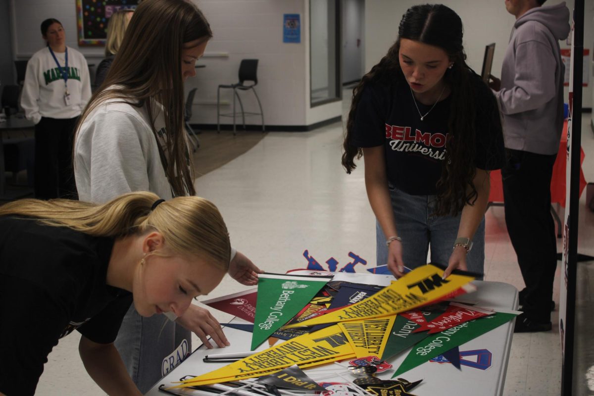 Everyone is excited to show off their college plans, whether it be writing it down on the whiteboards or holding one of the flags the counselors provided. 