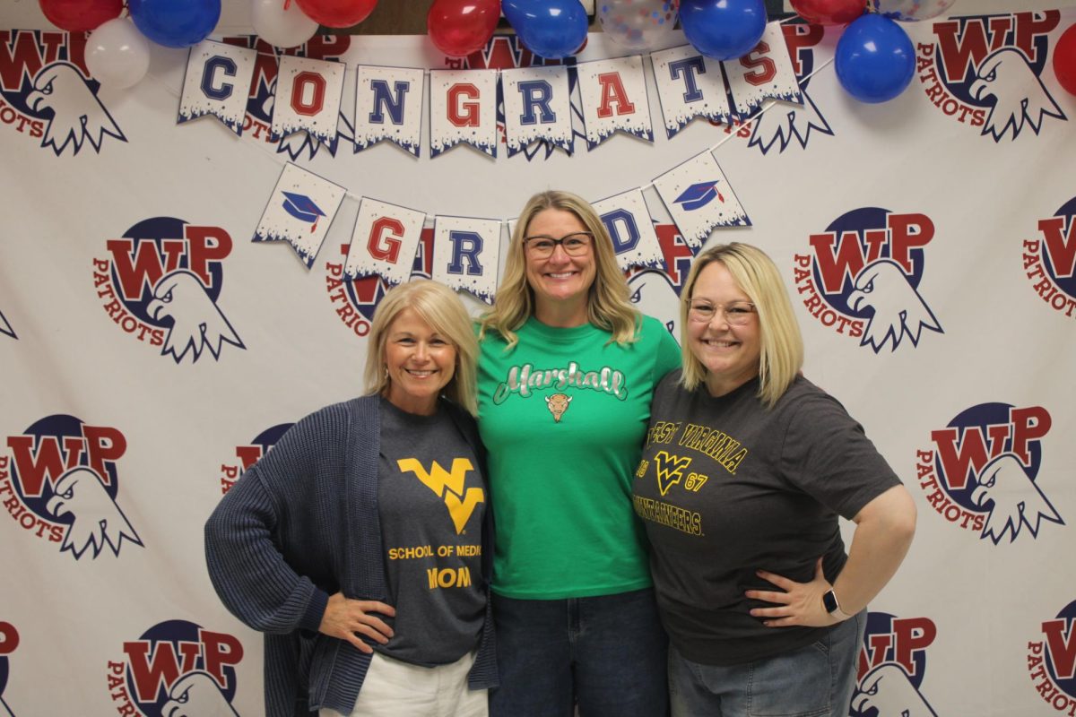 Counselors Betsy Jones, Jennifer Short, and Jennifer Mathieu all celebrating Decision Day with their students. 